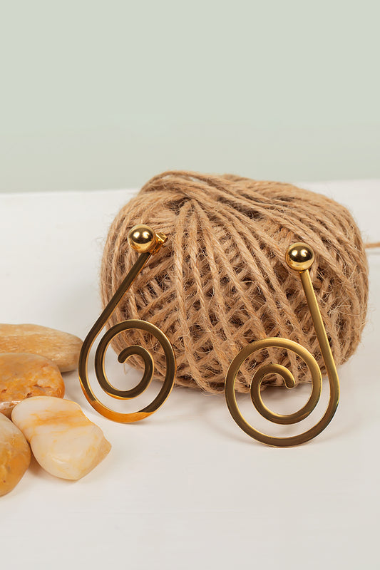 Model wearing Juzi earrings,gold plated stud long earrings with small circles at the end