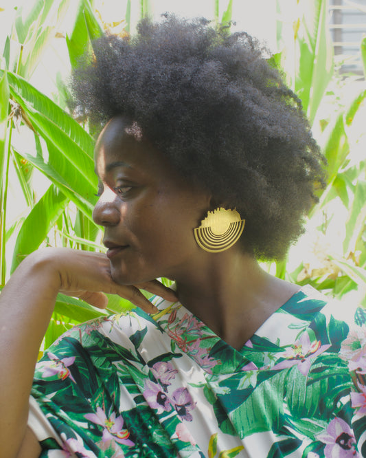 African black woman with afro hair wearing ZVET statement earrings