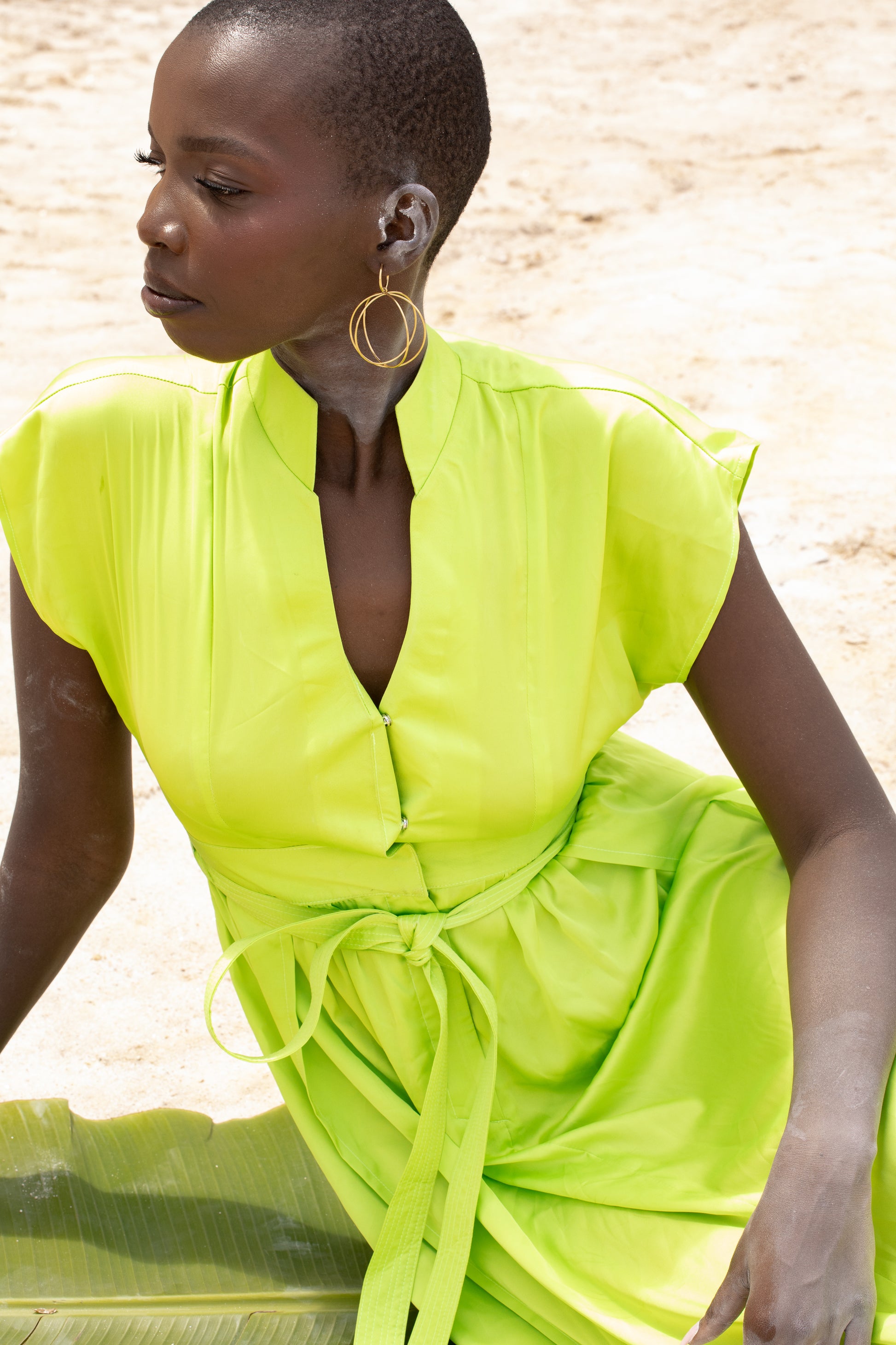 A black model wearing Zvet gold plated intertwined hoops symbolising ubuntu phiylosophy